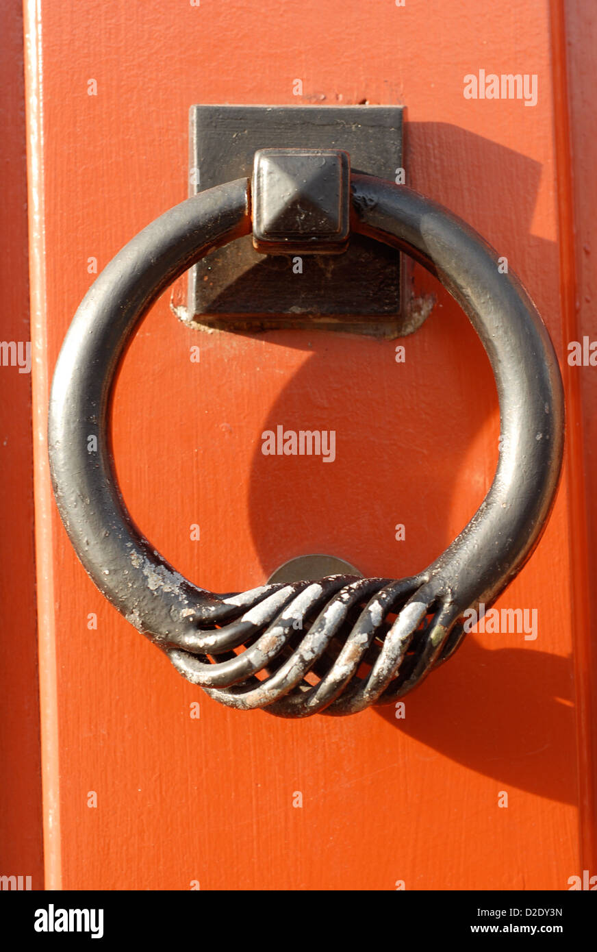 old door knocker on a red door Stock Photo Alamy