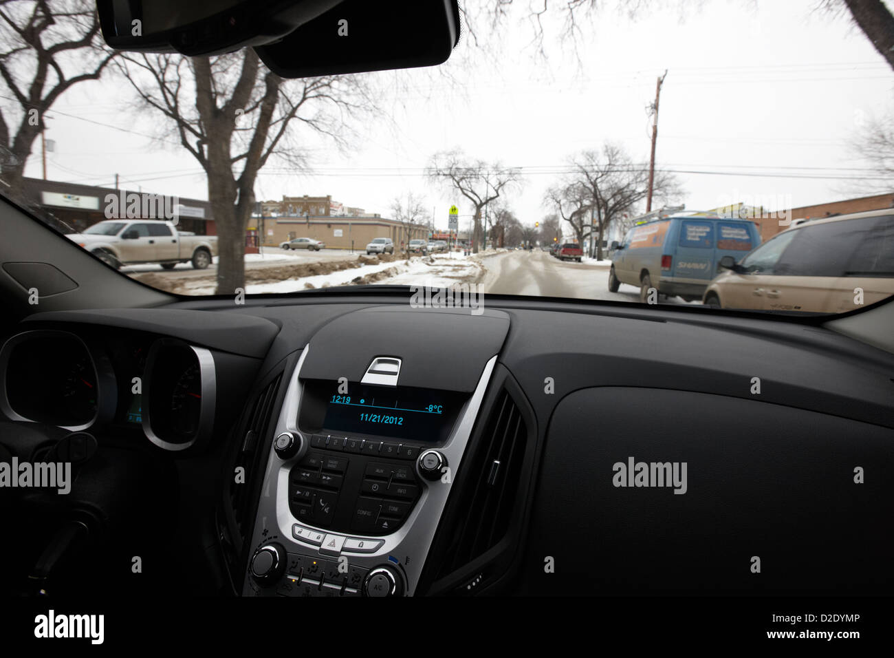 cold temperature reading on dashboard driving along snow covered streets saskatoon saskatchewan canada Stock Photo