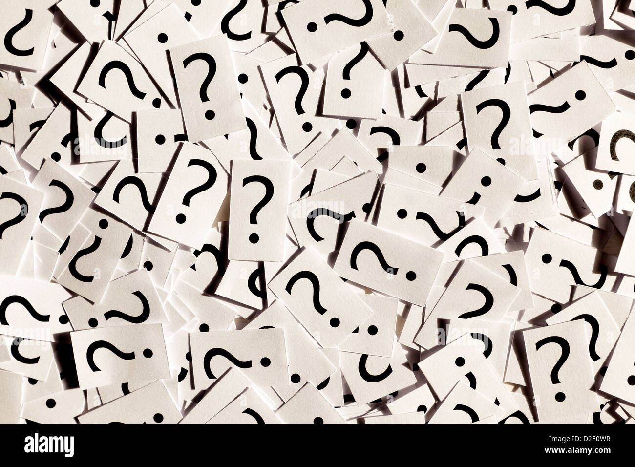 Just a lot of question marks on white papers. Stock Photo