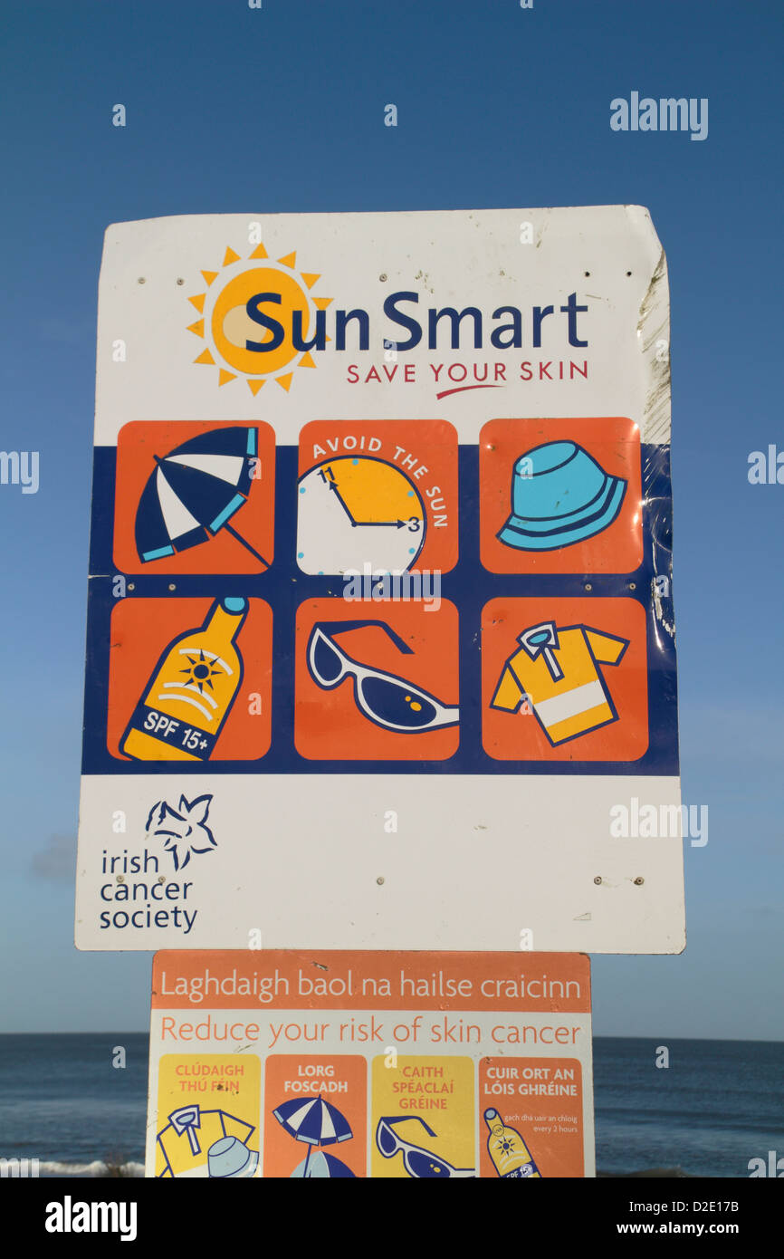 'Sun Smart' safety signs by the Irish Cancer Society on a beach near Wexford, Ireland. Stock Photo