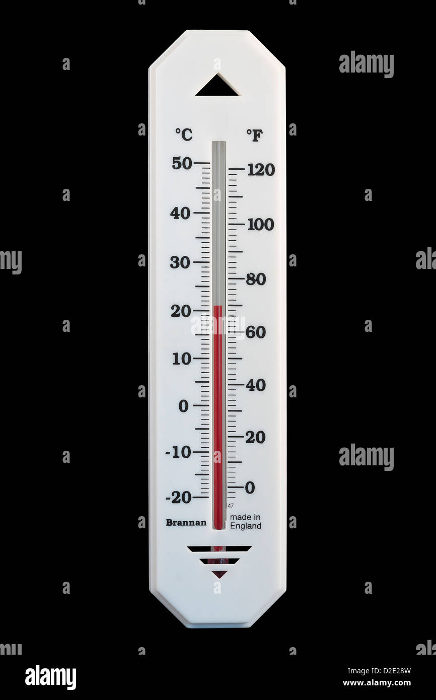 Celsius Centigrade and Fahrenheit Alcohol in Glass Thermometer reading 21ºC 70ºF isolated on black background Stock Photo
