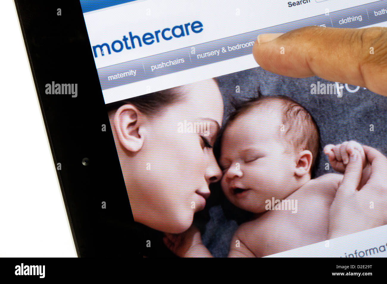 A person shopping on the internet at the Mothercare website, on an iPad, UK Stock Photo