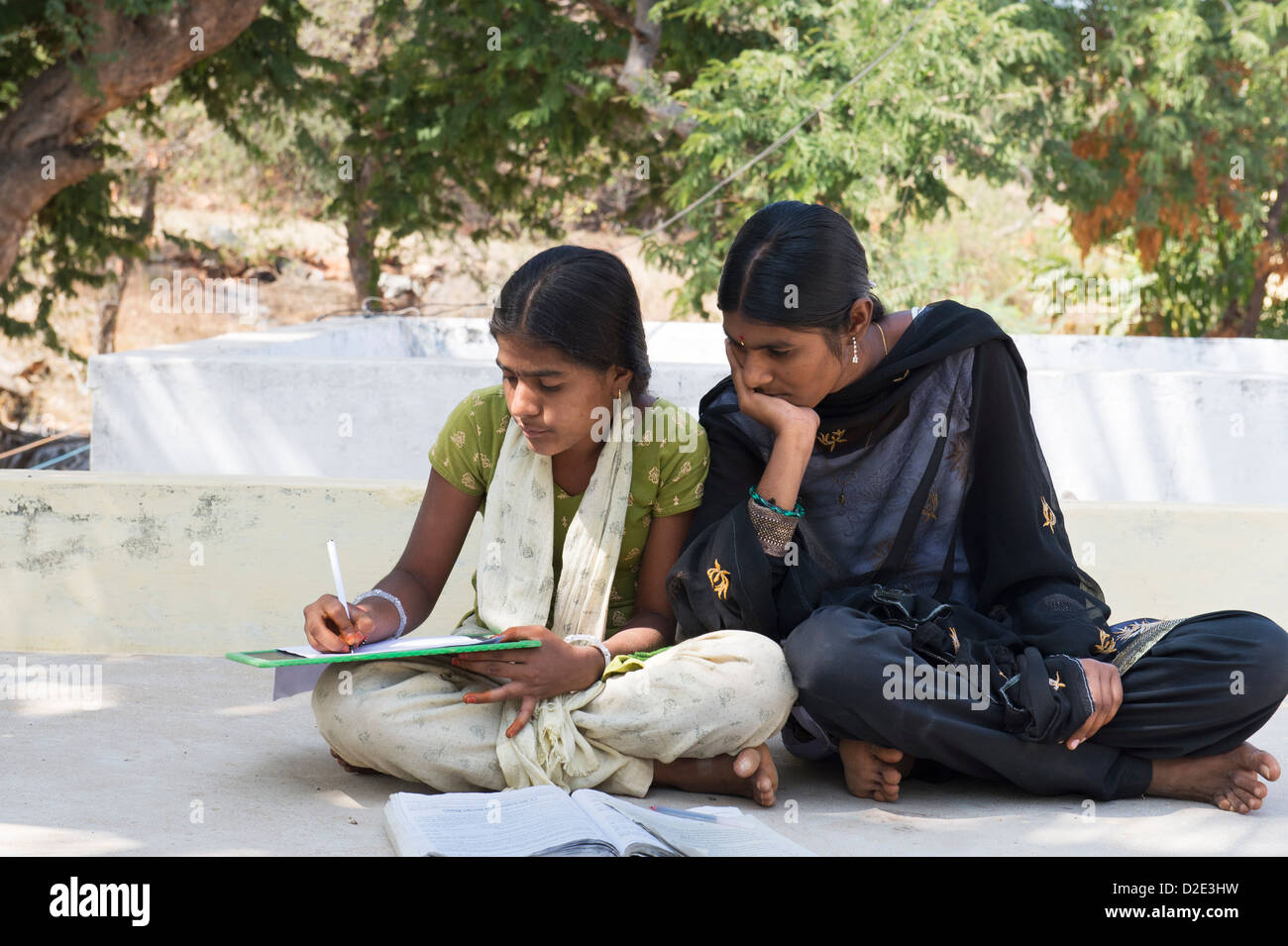 Indian school girls reading book hi-res stock photography and images ...