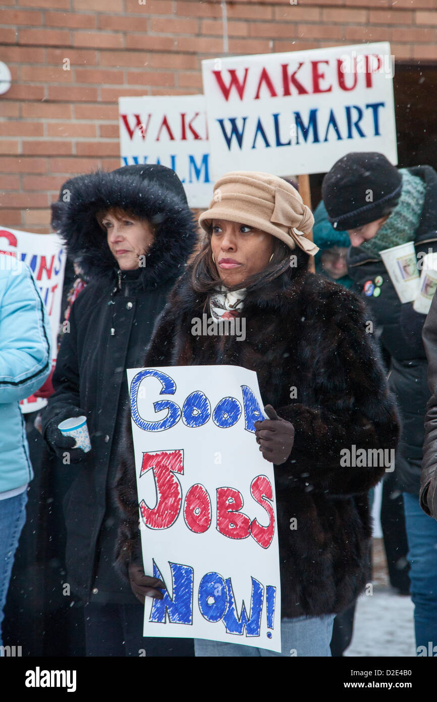 Southfield, Michigan - January 21, 2013 - Activists hold a 'Guns Out & Jobs In' vigil at the Church of St. Bede, opposing a plan to tear down the church to build a Walmart store. They noted that Walmart is the biggest gun distributor in America, and that the retailer's jobs pay less than a living wage. The church has been vacant since the Archdiocese of Detroit merged four Catholic churches in 2007. Stock Photo