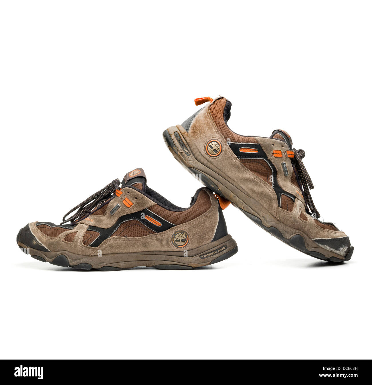 One pair of worn out brown Timberland hiking shoes Stock Photo - Alamy