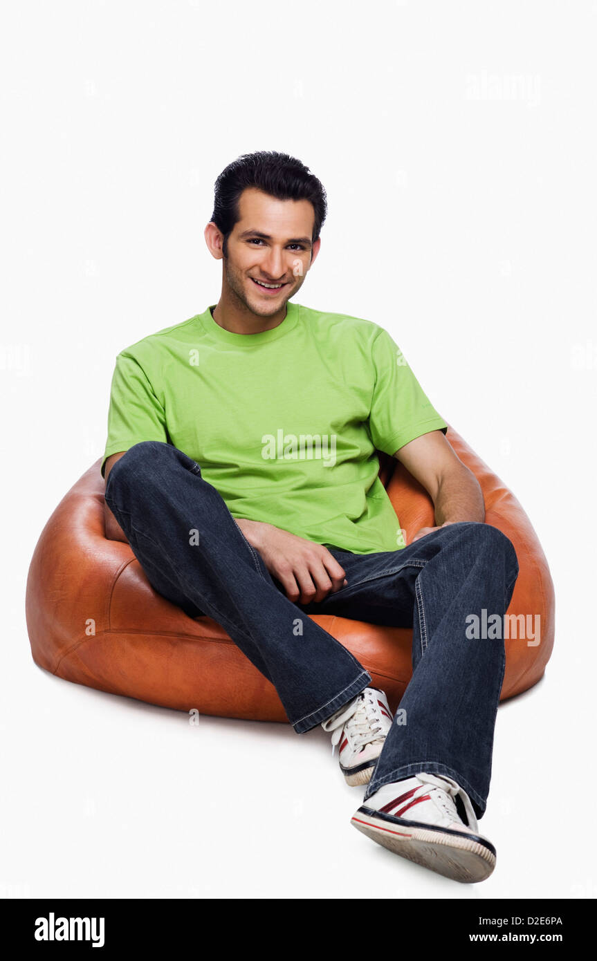 Man sitting on bean bag Cut Out Stock Images & Pictures - Alamy