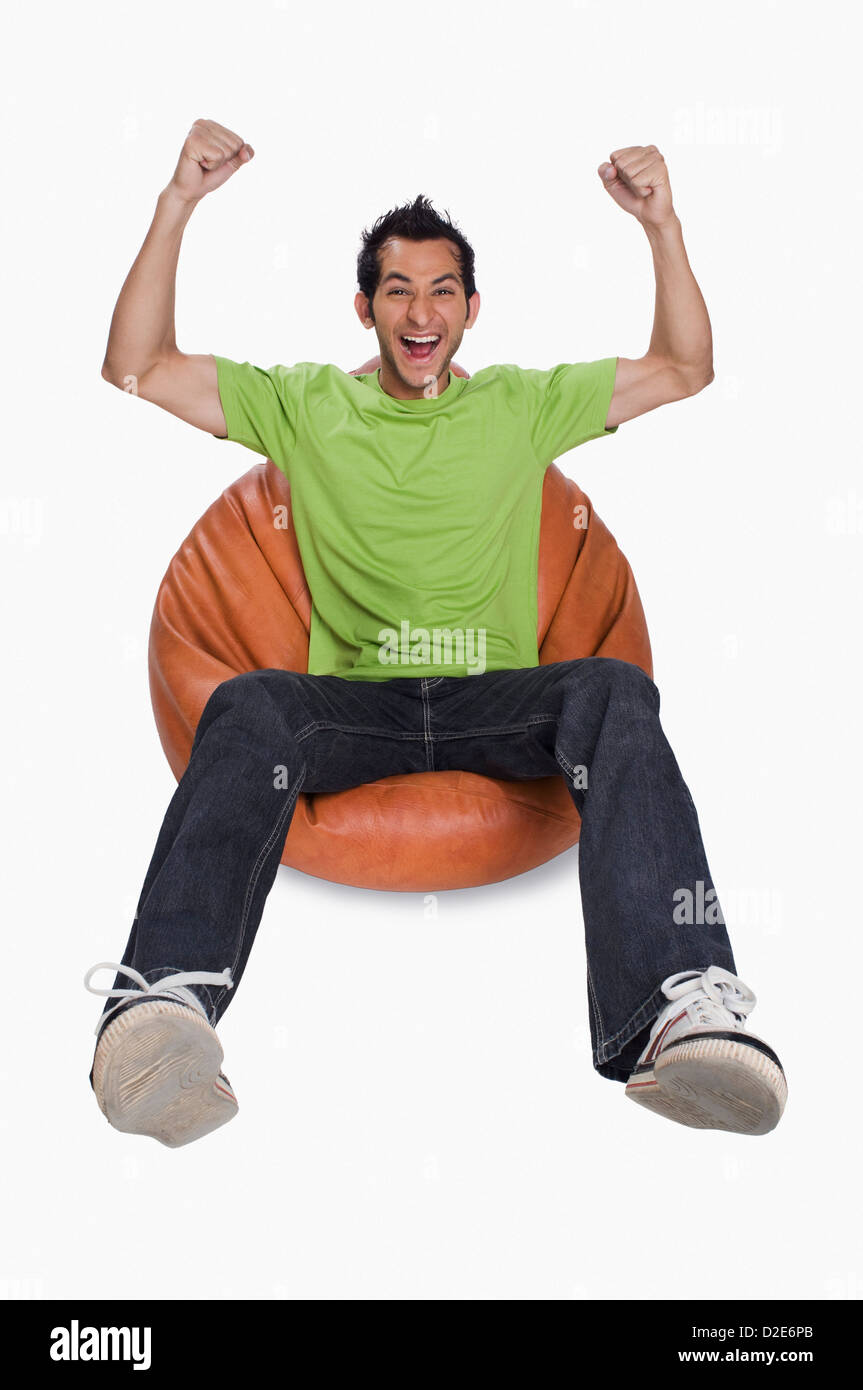 Man sitting on bean bag Cut Out Stock Images & Pictures - Alamy