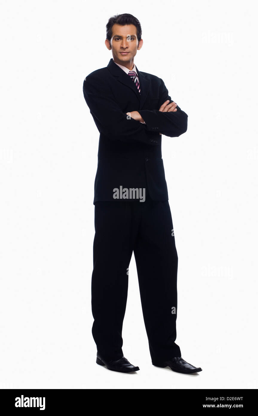 Portrait of a businessman standing with his arms crossed Stock Photo ...