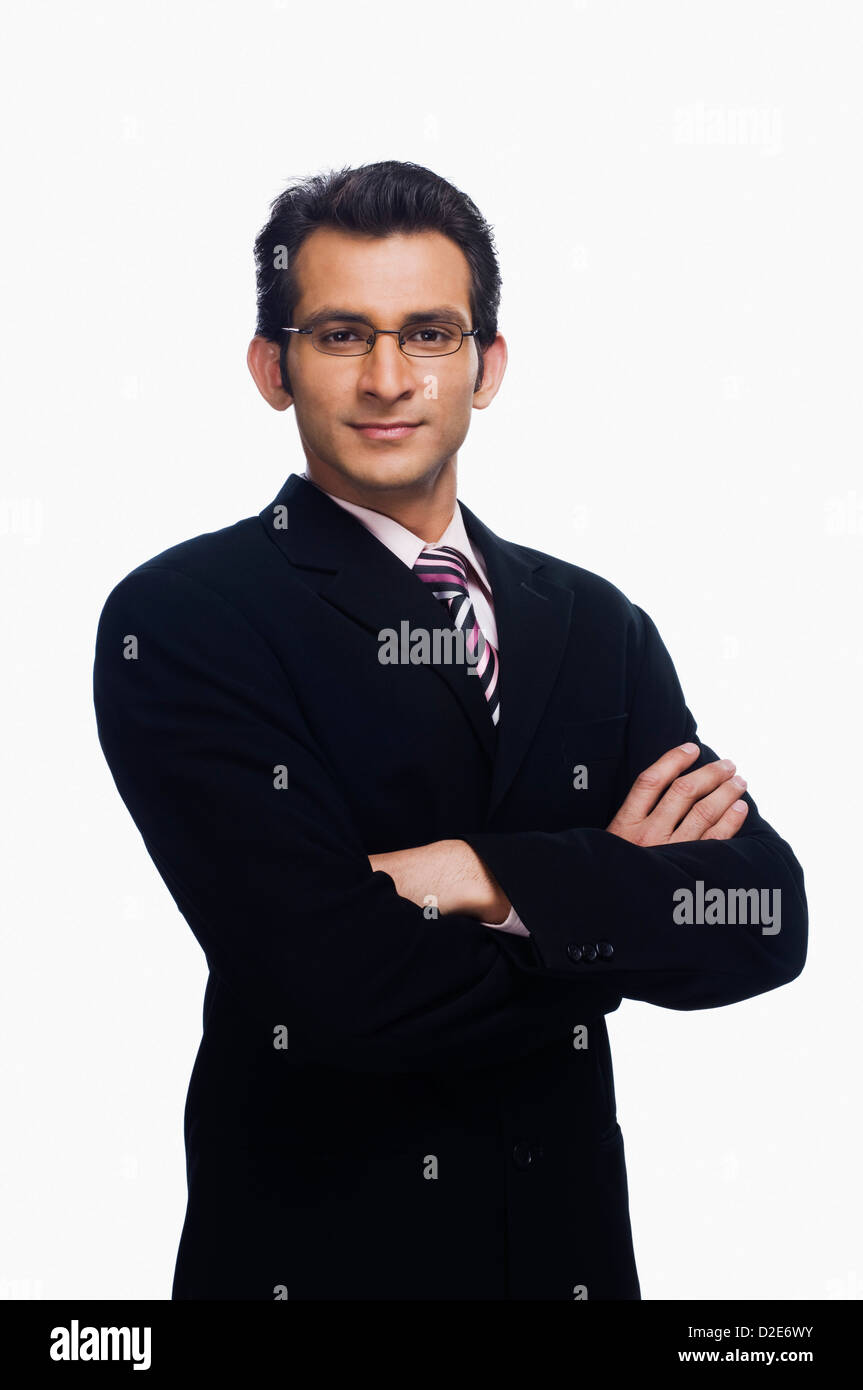 Portrait of a businessman standing with his arms crossed Stock Photo ...