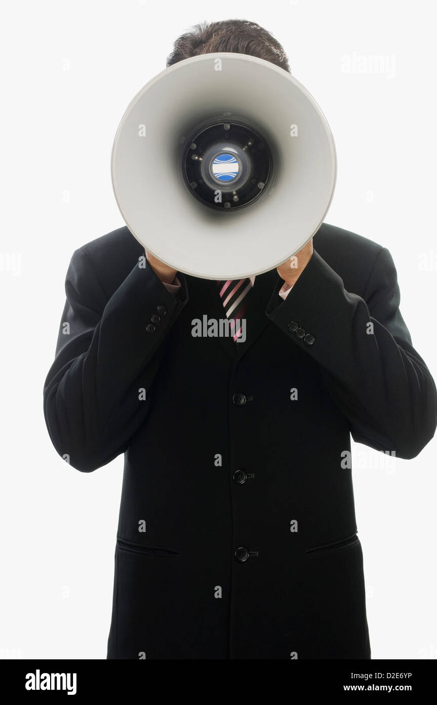 Businessman using a megaphone Stock Photo - Alamy