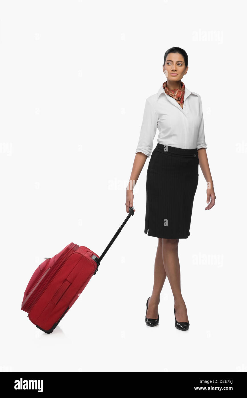 Air hostess carrying her luggage Stock Photo