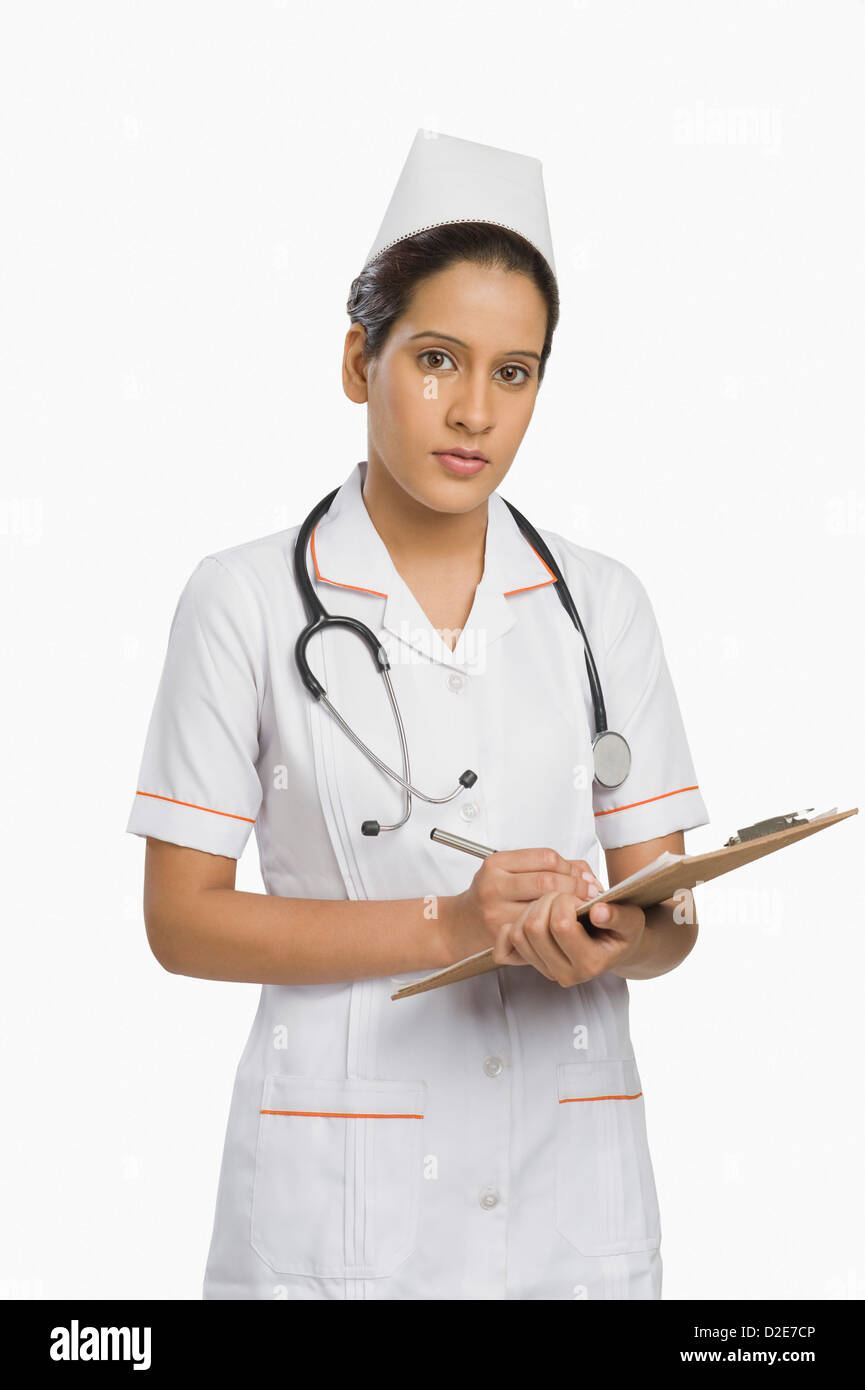 Portrait of a female nurse holding a clipboard Stock Photo - Alamy
