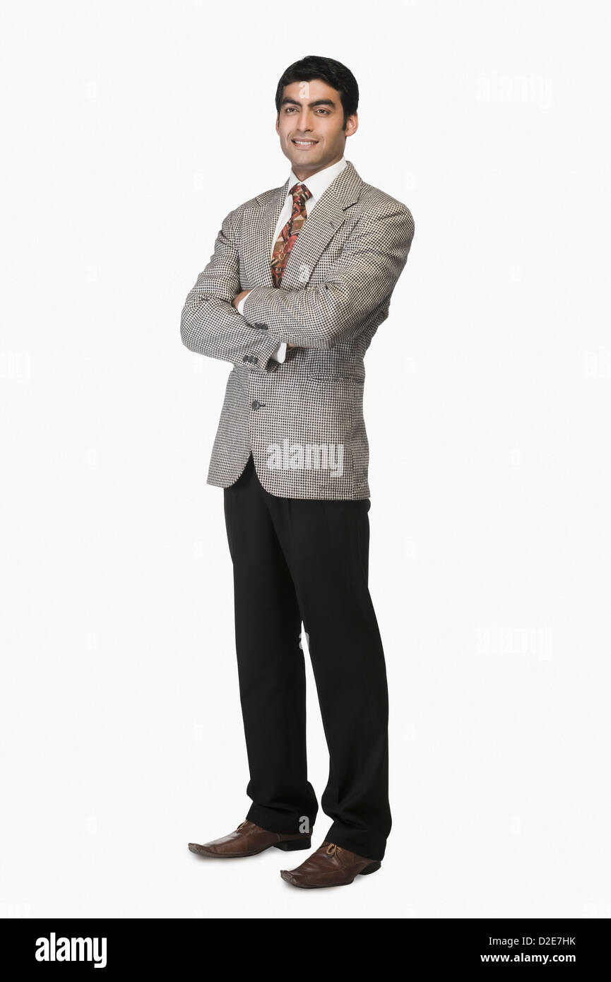 Portrait of a businessman standing with arms crossed Stock Photo - Alamy