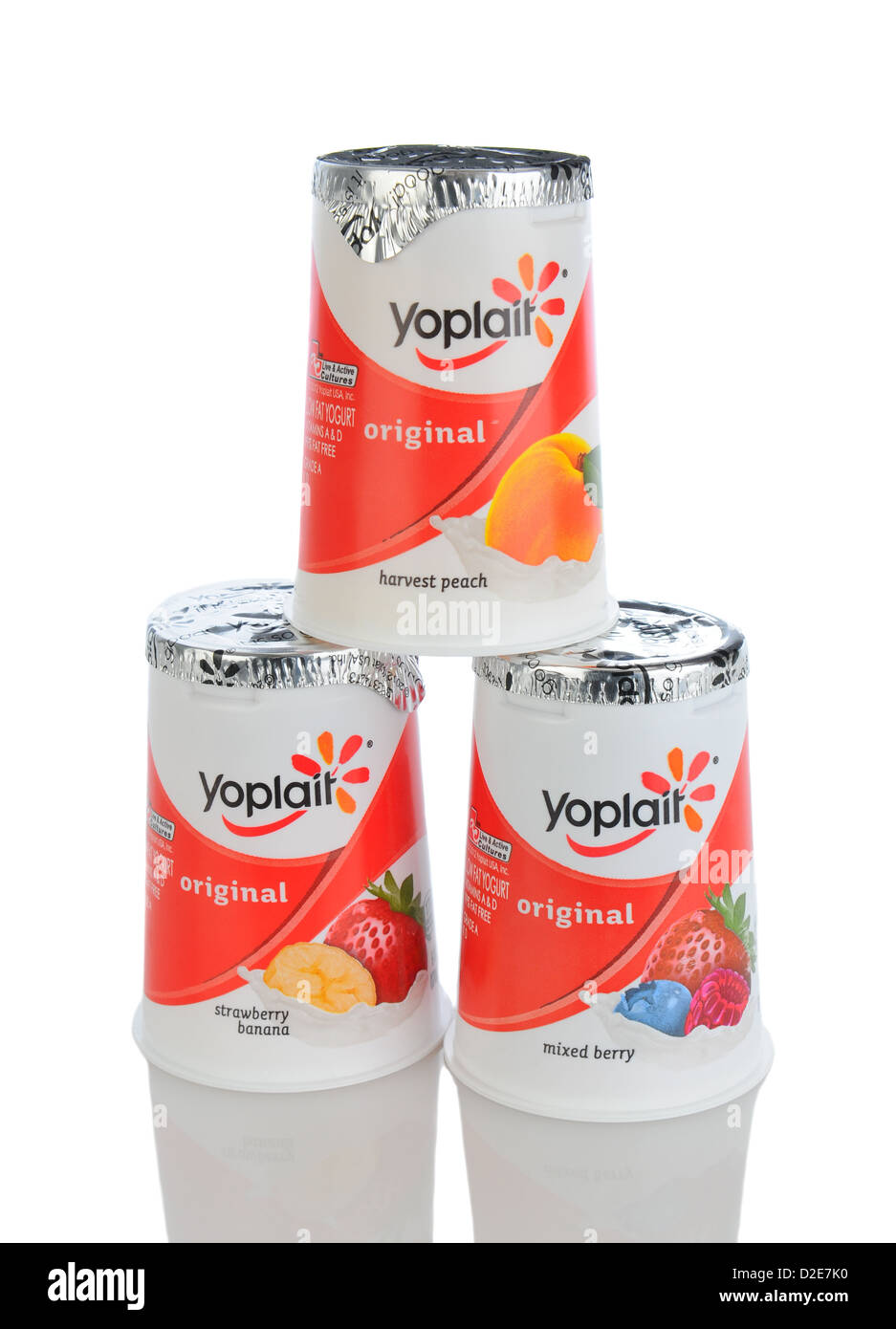 Three Yoplait Yogurt Containers isolated on white with reflection. Stock Photo