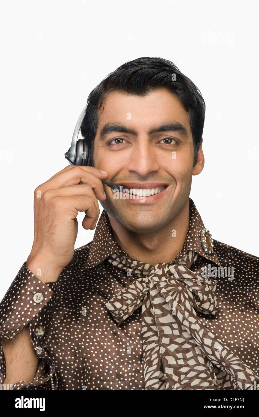 Portrait of a male customer care representative wearing a headset Stock ...