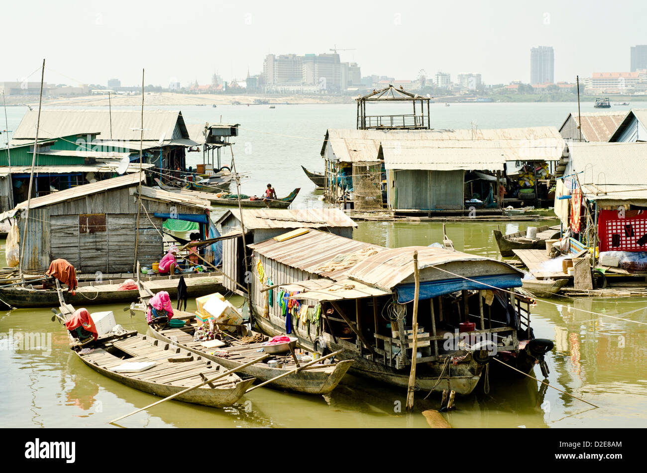 Floating village on the Mekong river in Phnom Penh , 500 meters from some of the most expensive city hotels. Stock Photo