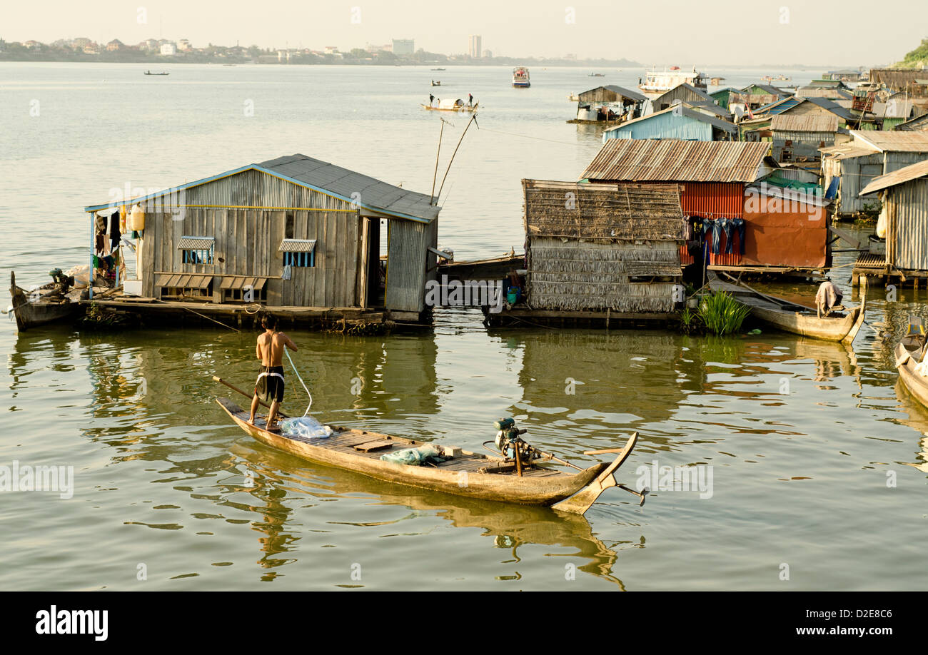 Floating village on the Mekong river in Phnom Penh , 500 meters from some of the most expensive city hotels. Stock Photo