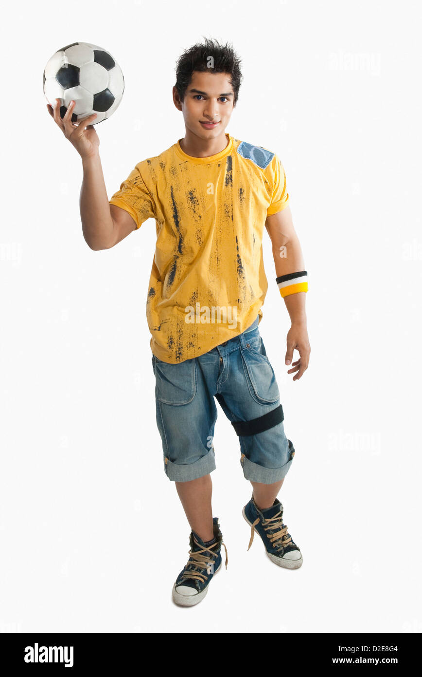 Portrait of a man holding a soccer ball Stock Photo - Alamy