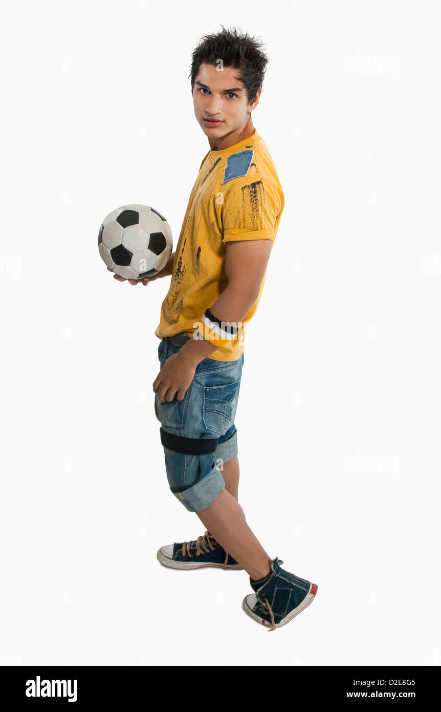 Portrait of a man holding a soccer ball Stock Photo - Alamy