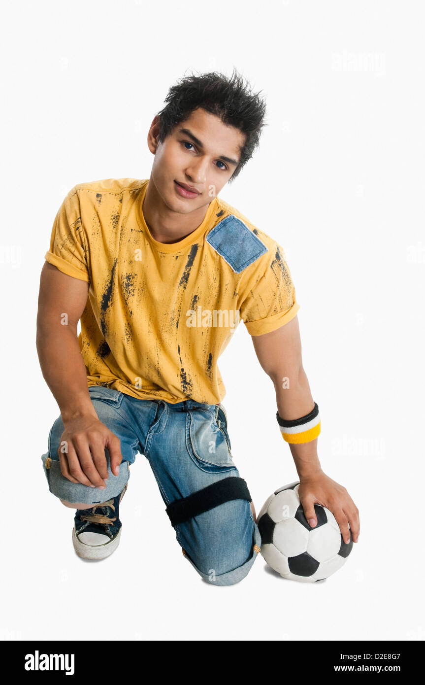 Portrait of a man holding a soccer ball Stock Photo - Alamy