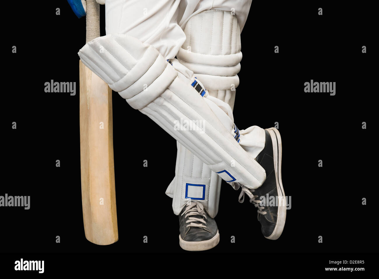 Low section view of a cricket batsman standing at a nonstriker end