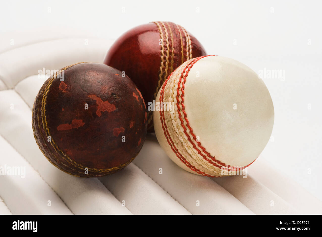 Close-up of cricket balls on cricket pads Stock Photo