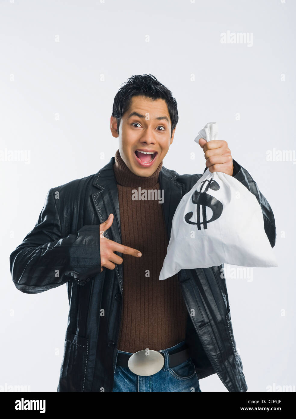 Portrait of a man holding a money bag Stock Photo - Alamy