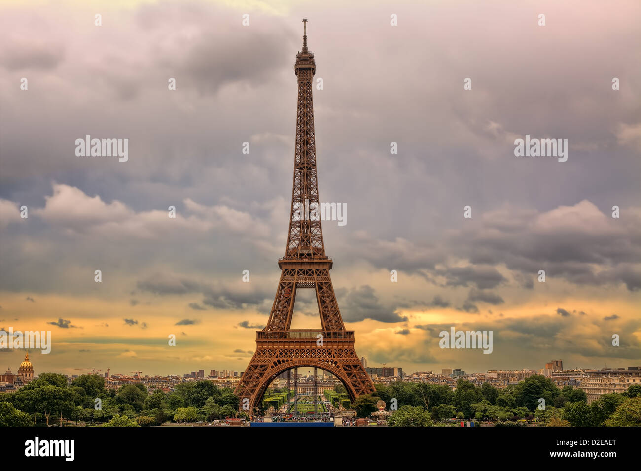Famous Eiffel Tower under beautiful cloudy sky at sunset in Paris, France. Stock Photo