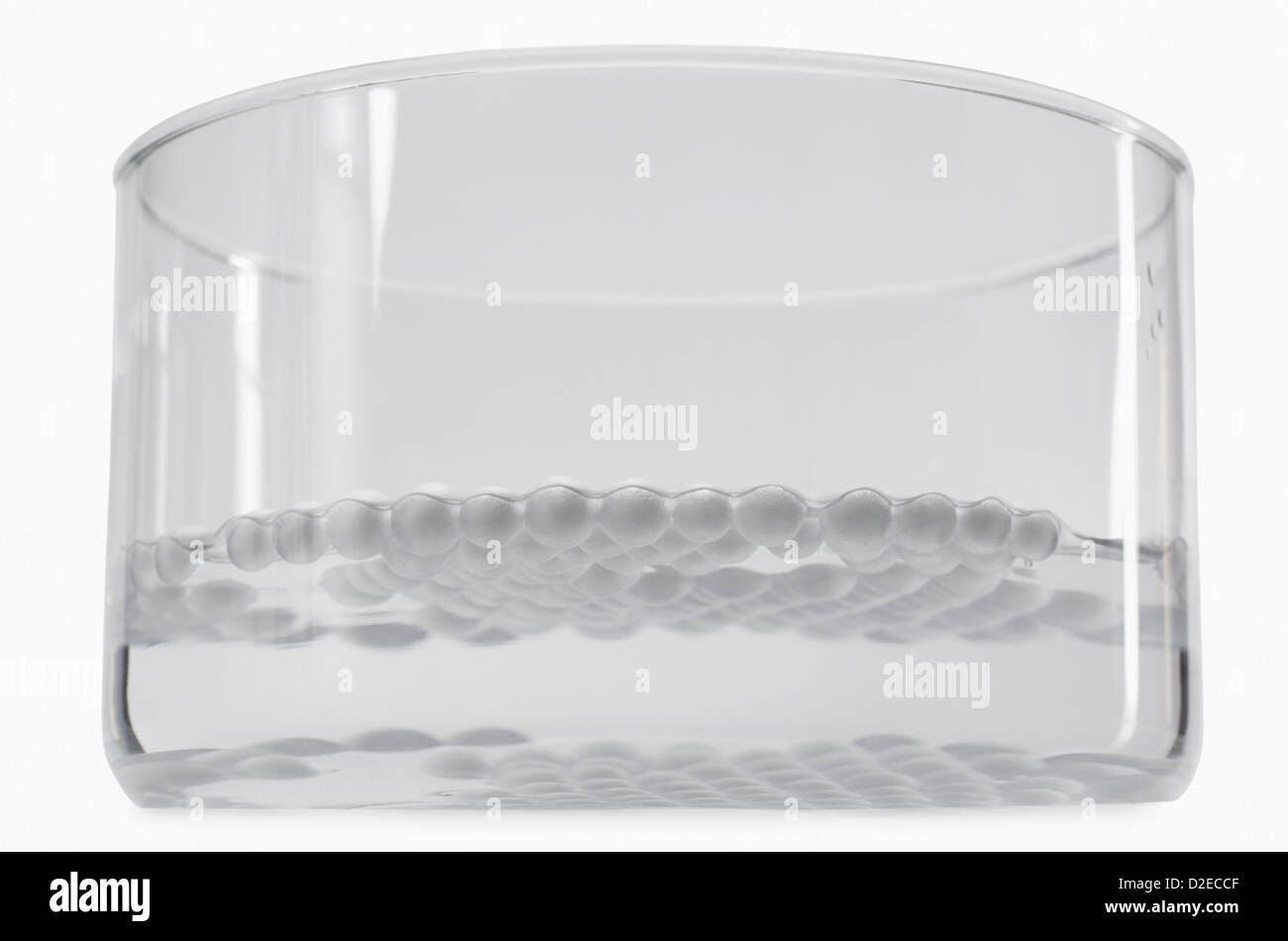 Closeup of styrofoam balls floating on water in a bowl Stock Photo Alamy