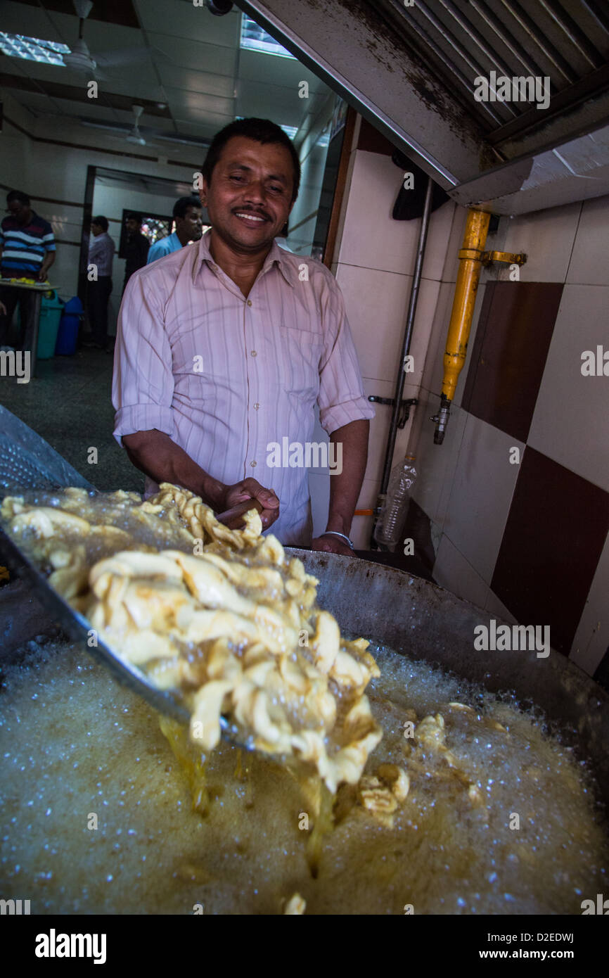 Deep frying, Ahmedabad, Gujarat, India Stock Photo