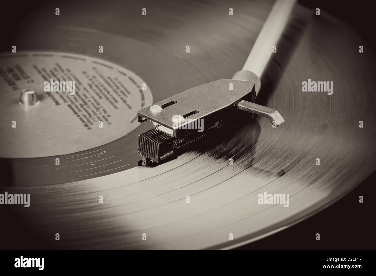 Spinning vinyl record. Motion blur image. Vintage toned. Stock Photo