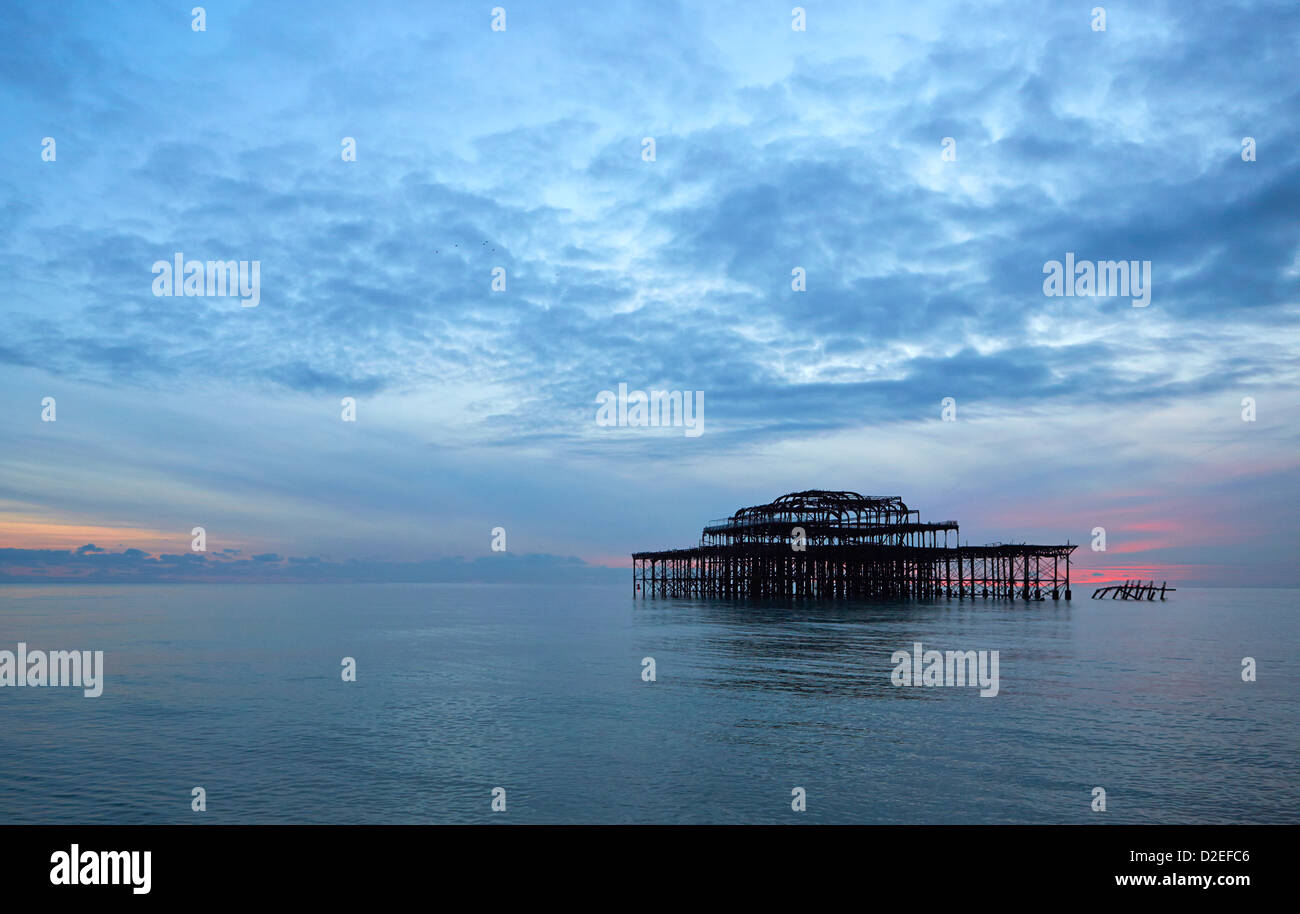 Brighton iconic West pier skeletal remains damaged by fire and storms taken at sunset Stock Photo