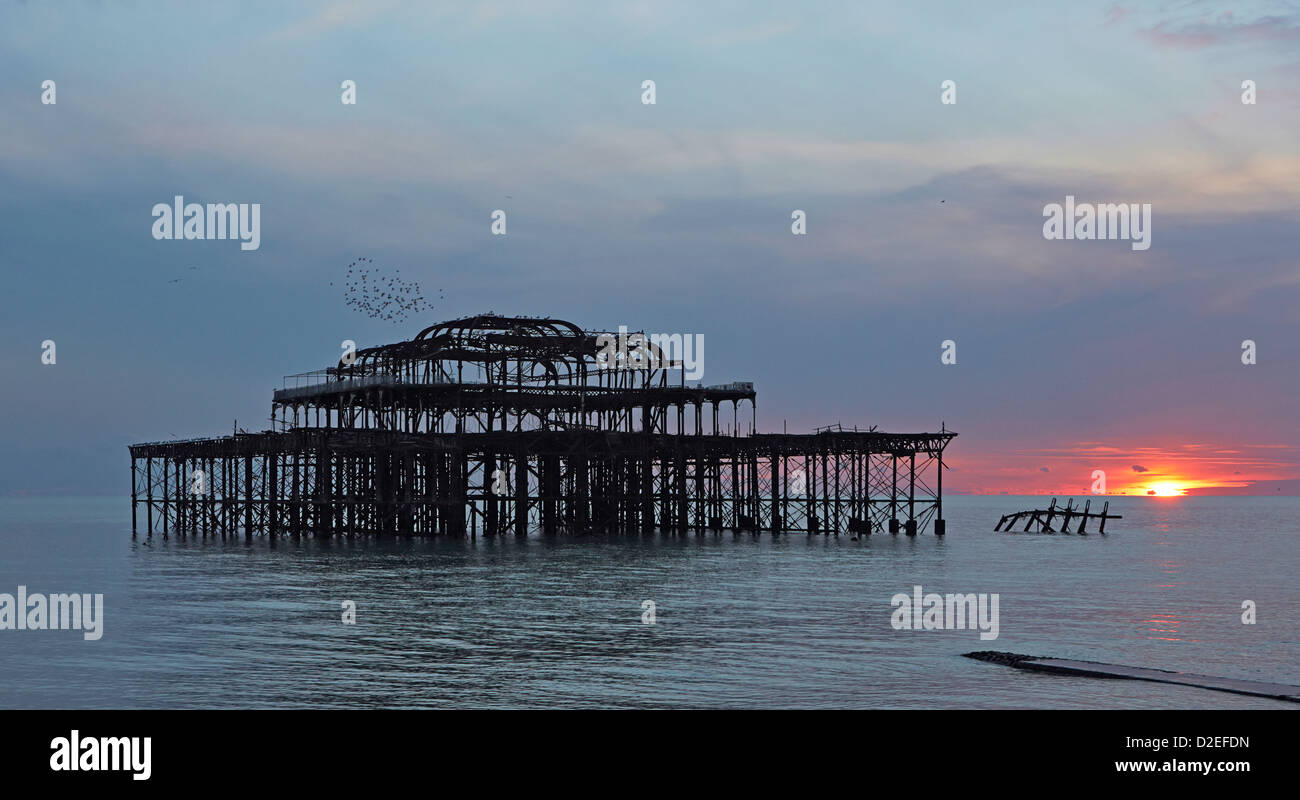 Brighton iconic West pier skeletal remains damaged by fire and storms taken at sunset Stock Photo