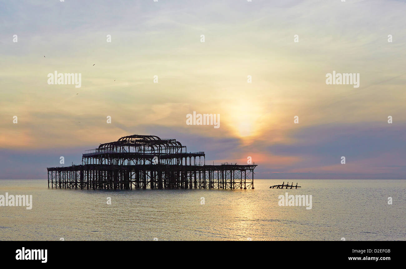 Brighton iconic West pier skeletal remains damaged by fire and storms taken at sunset Stock Photo