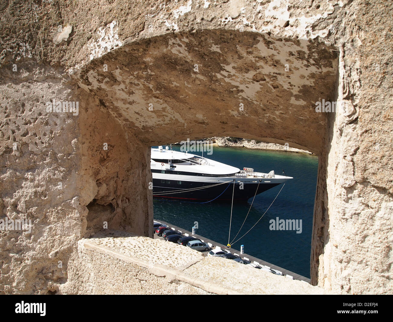 A view at nice ship through a stony window Stock Photo