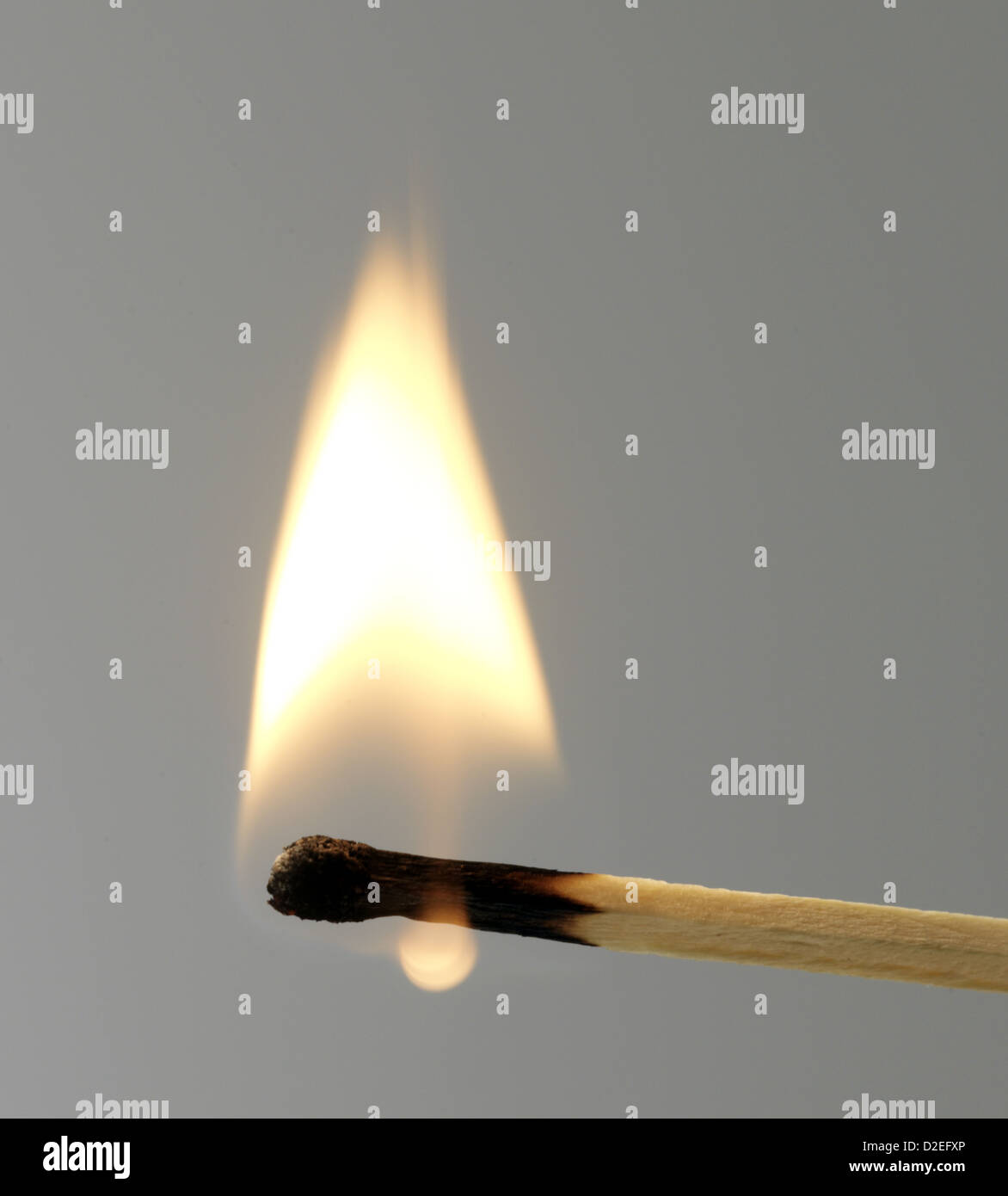 lit match, grey background Stock Photo - Alamy