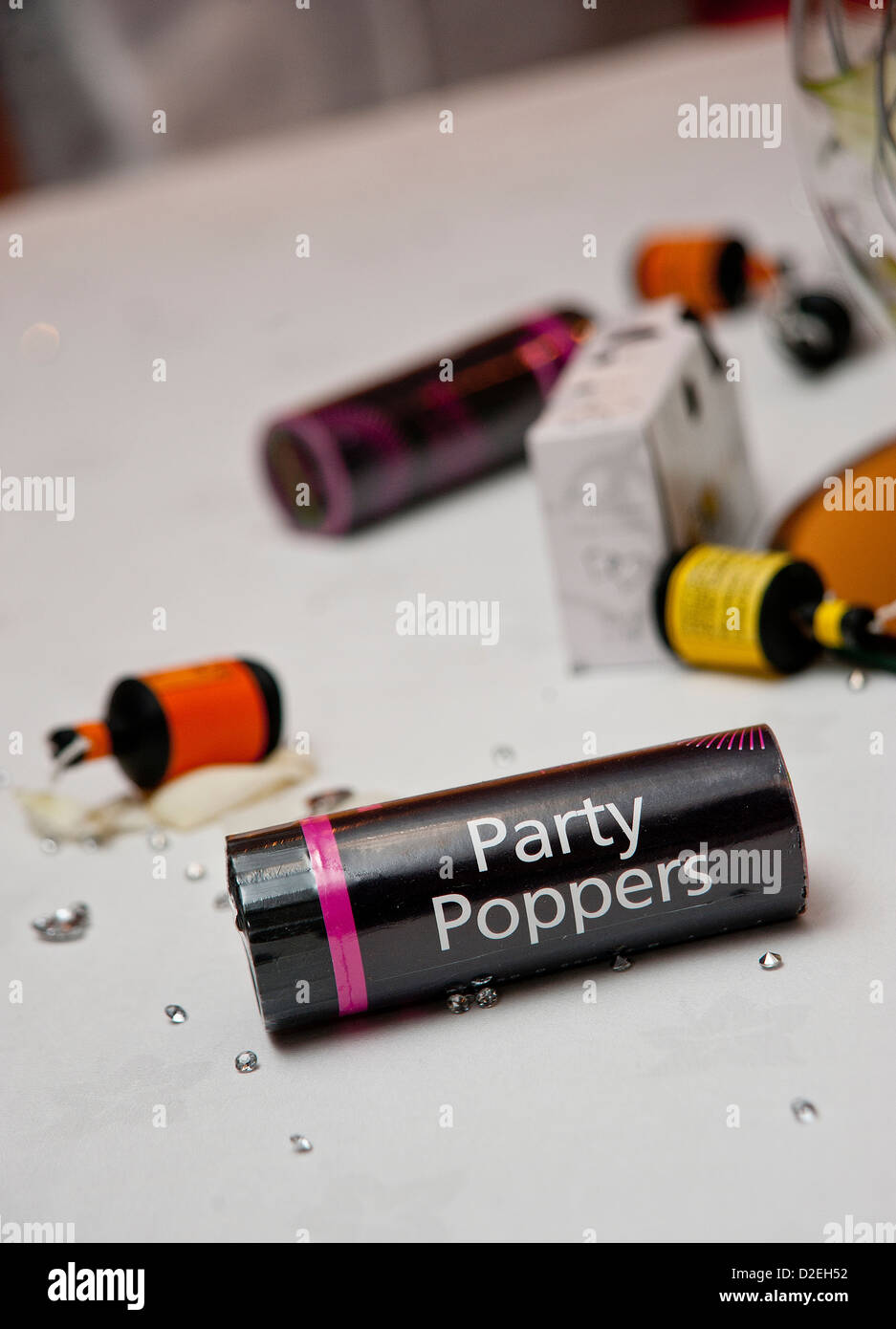 Party poppers left on a table at a party Stock Photo