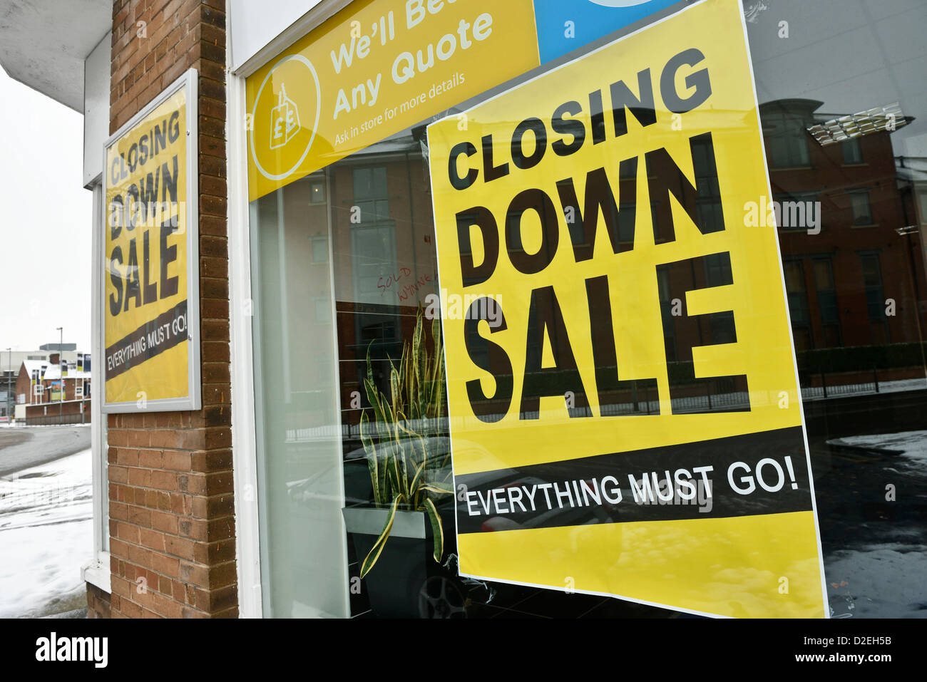 Closing down sale poster in a shop window Stock Photo