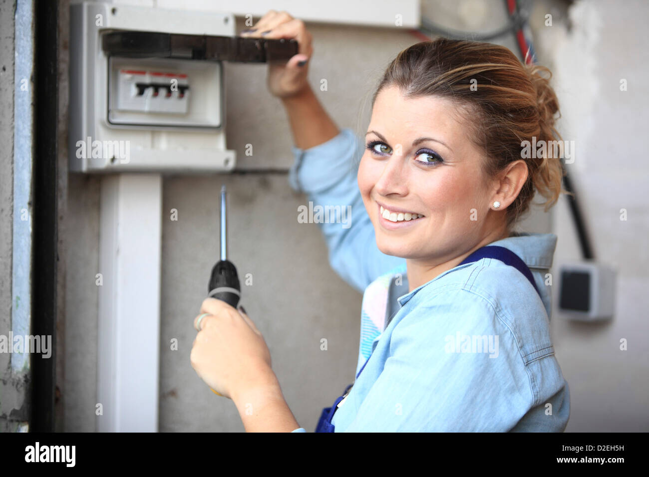 France, young woman with screwdriver tool Stock Photo