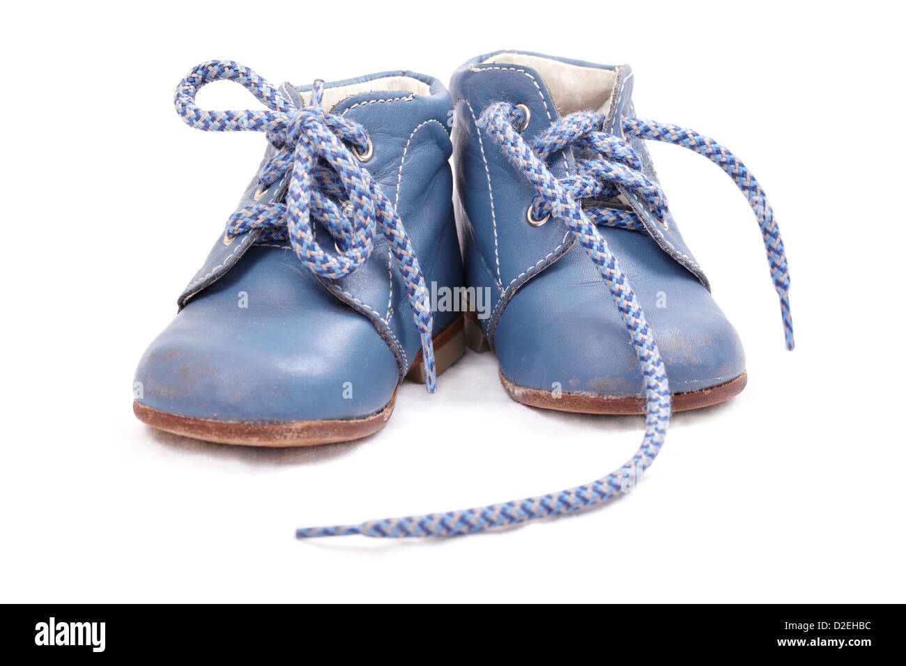 Old baby shoes isolated on white background Stock Photo - Alamy