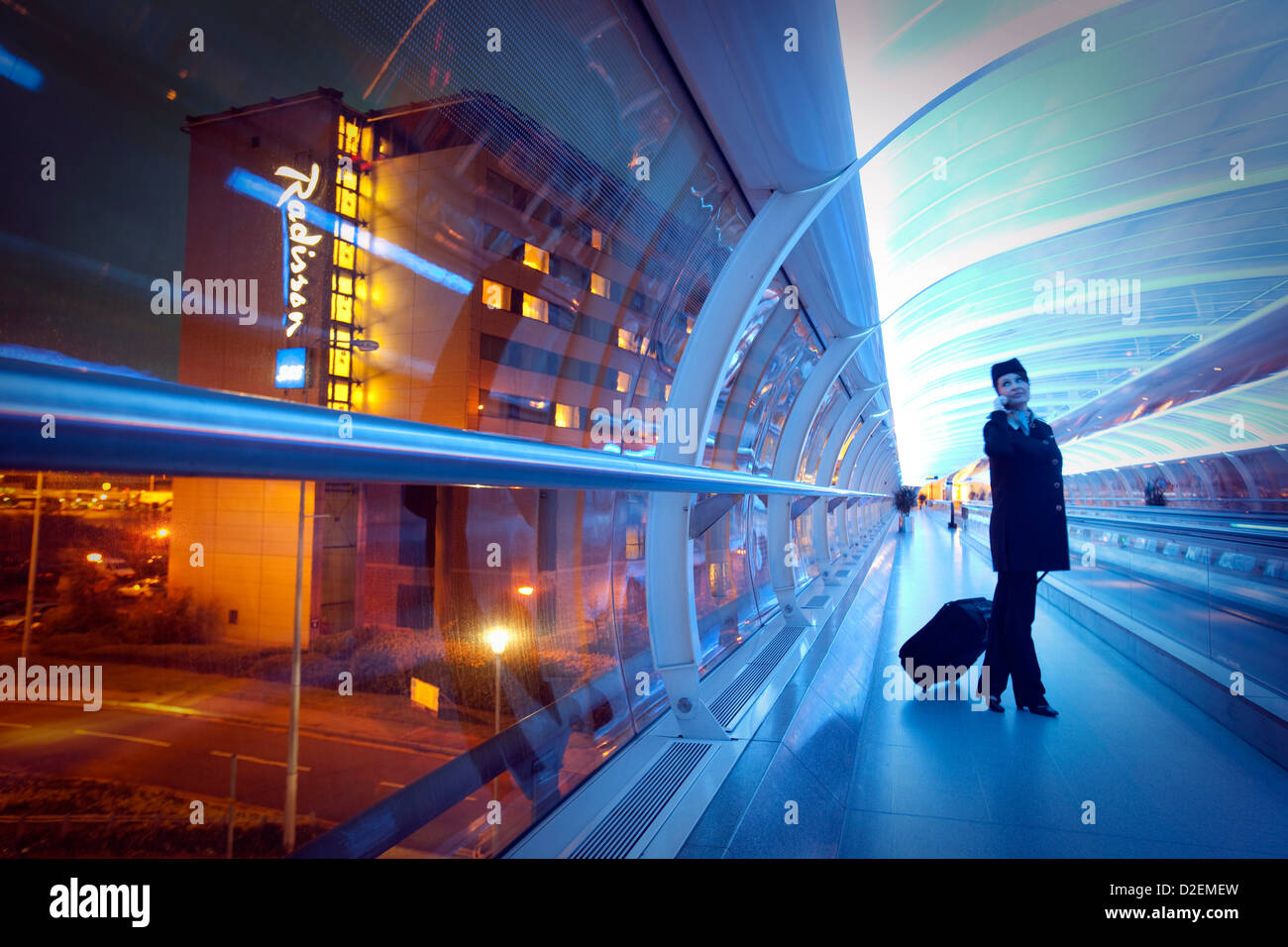 Air Atlanta Icelandic air hostess at Manchester Airport inside the skylink tube Stock Photo