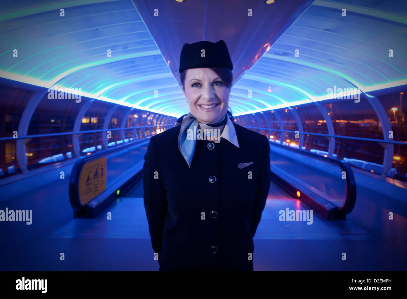 Air Atlanta Icelandic air hostess at Manchester Airport inside the skylink tube Stock Photo