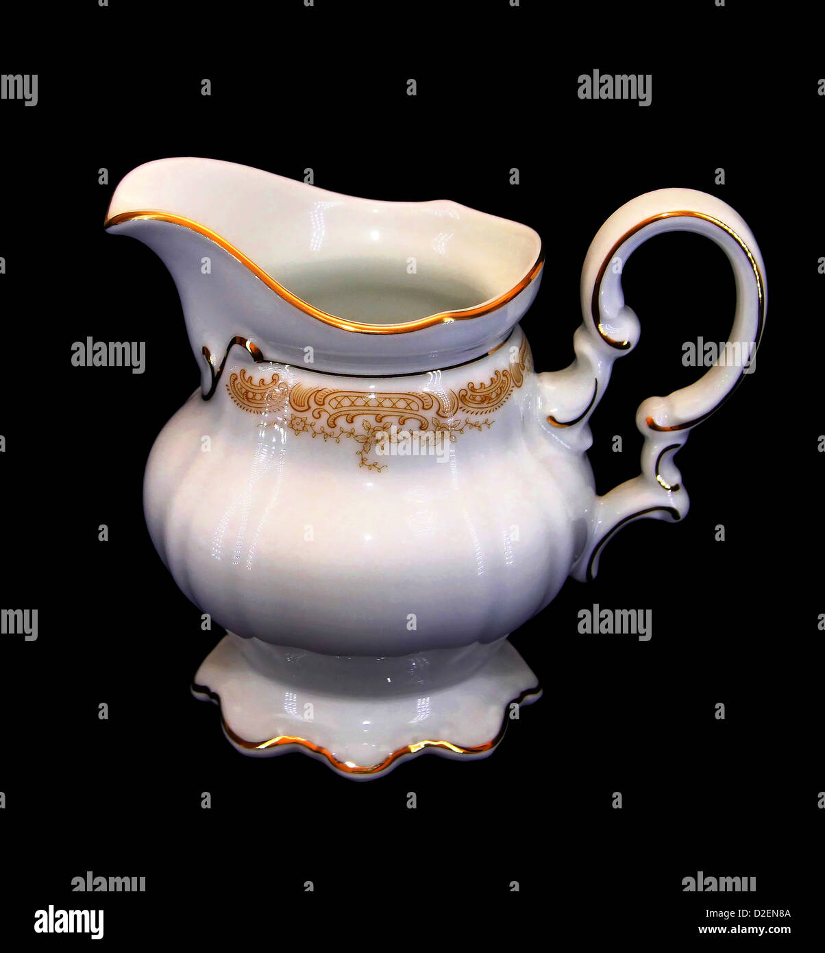 Isolated Expensive Porcelain Teaset Milk Jar with Golden Brim Stock