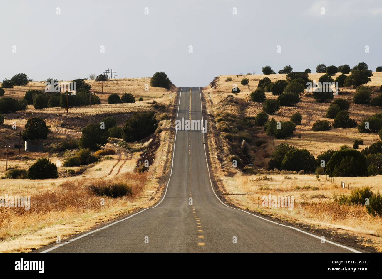 The famous road, Route 66, stretches across the Arizona desert near Seligman, NM. Stock Photo