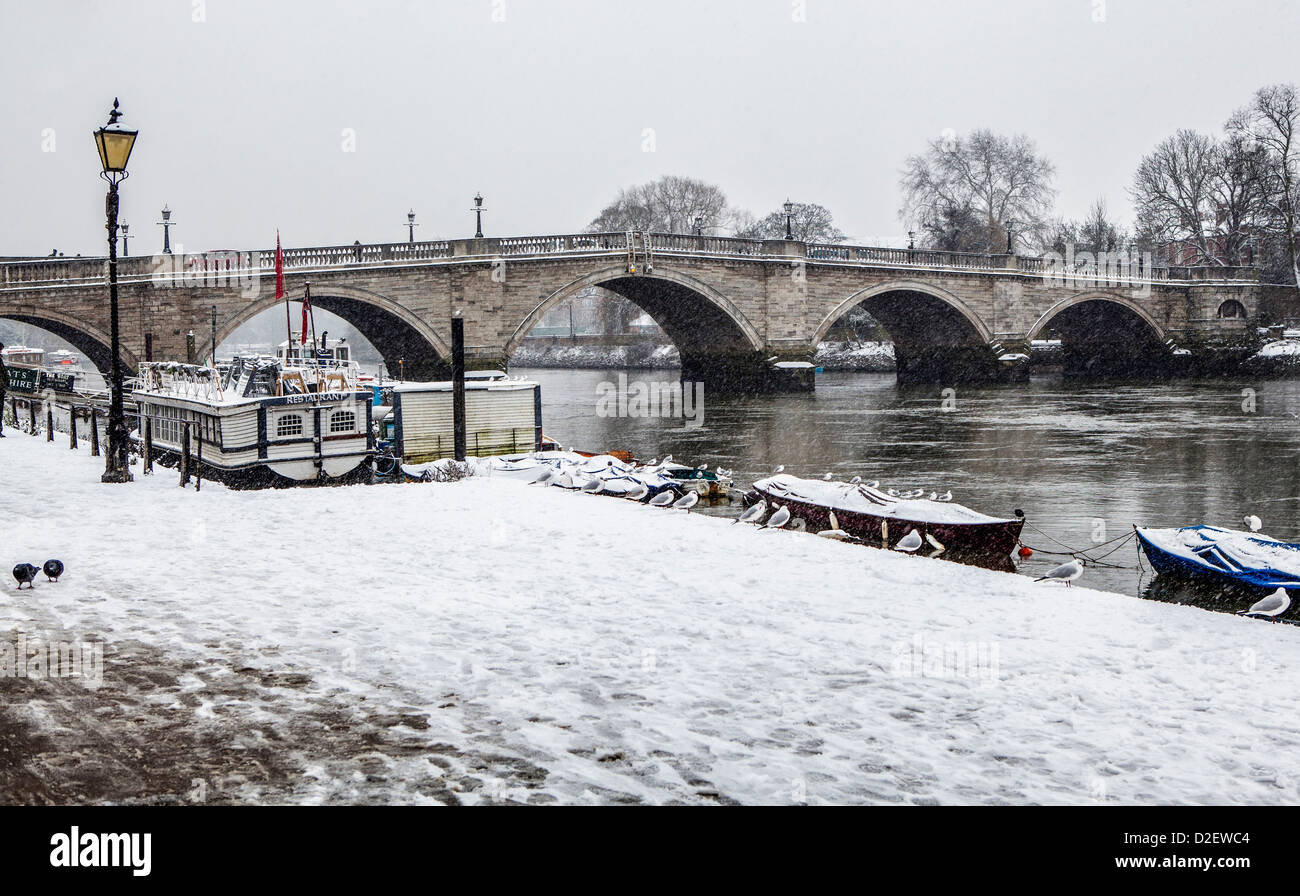 View of  Richmond bridge and the Thames river after a heavy snow fall in Winter - Richmond upon Thames, Greater London, Surrey, UK Stock Photo