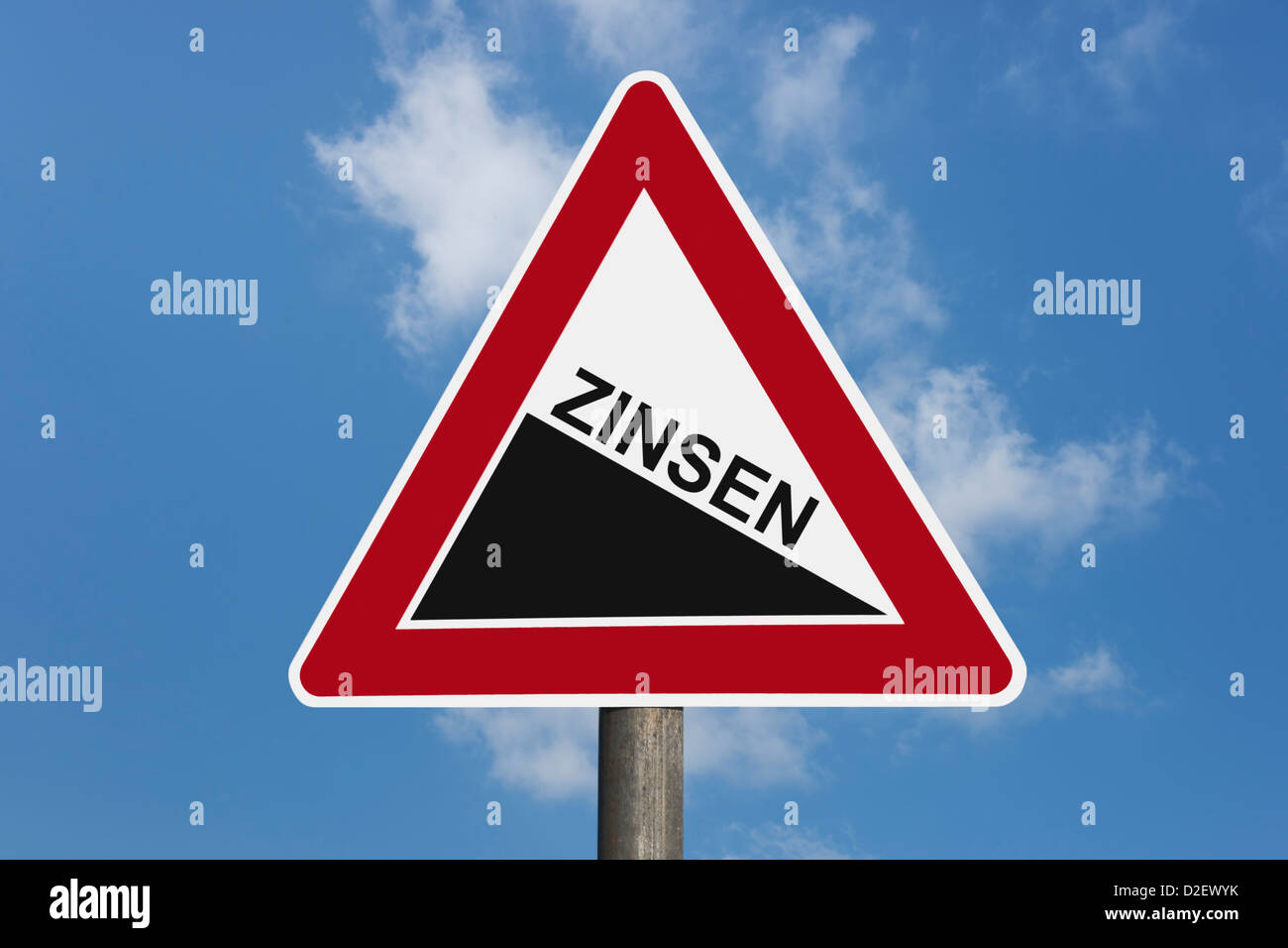 Detail photo of a danger sign 'Steep hill downwards' with the German inscription interest rate Stock Photo