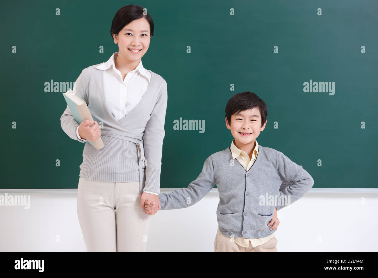 Portrait of happy schoolchildren in classroom Stock Photo