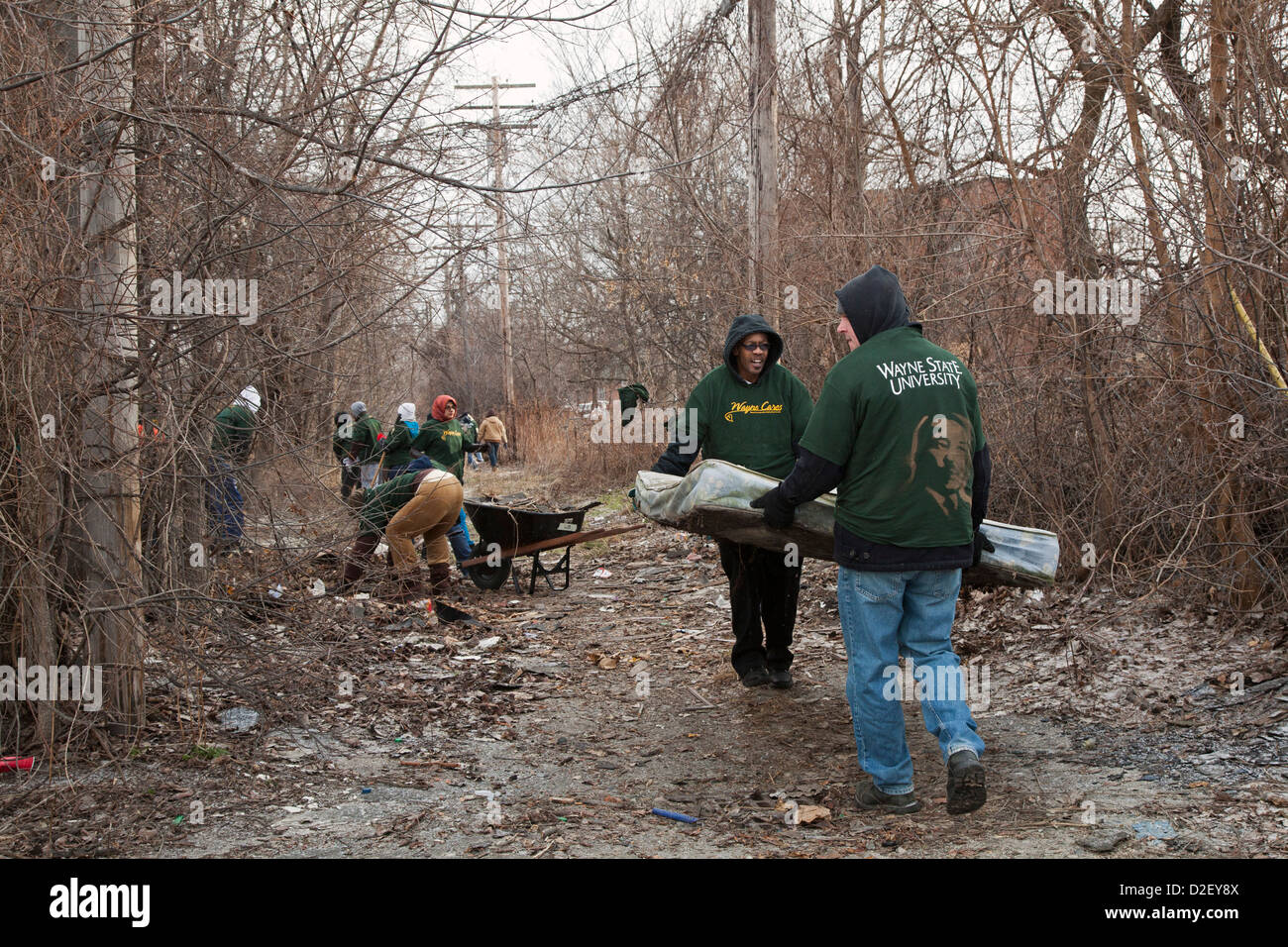 On Martin Luther King Day, college students and neighborhood residents volunteered to clean trash from vacant properties. Stock Photo