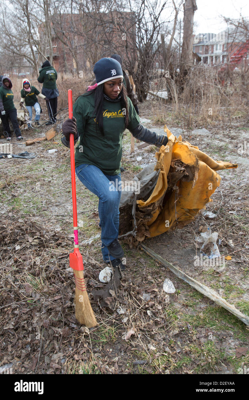 On Martin Luther King Day, college students and neighborhood residents volunteered to clean trash from vacant properties. Stock Photo