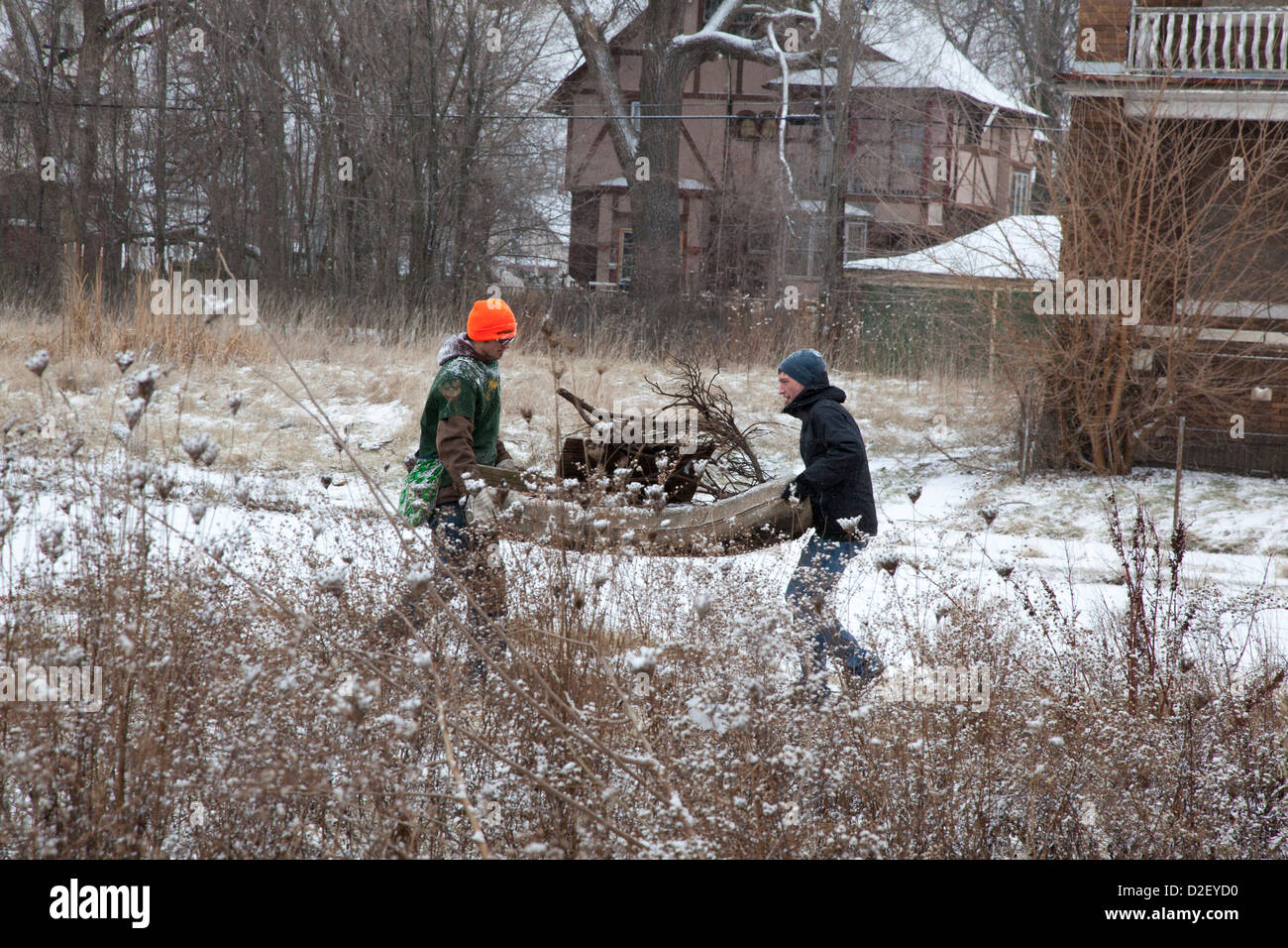 On Martin Luther King Day, college students and neighborhood residents volunteered to clean trash from vacant properties. Stock Photo